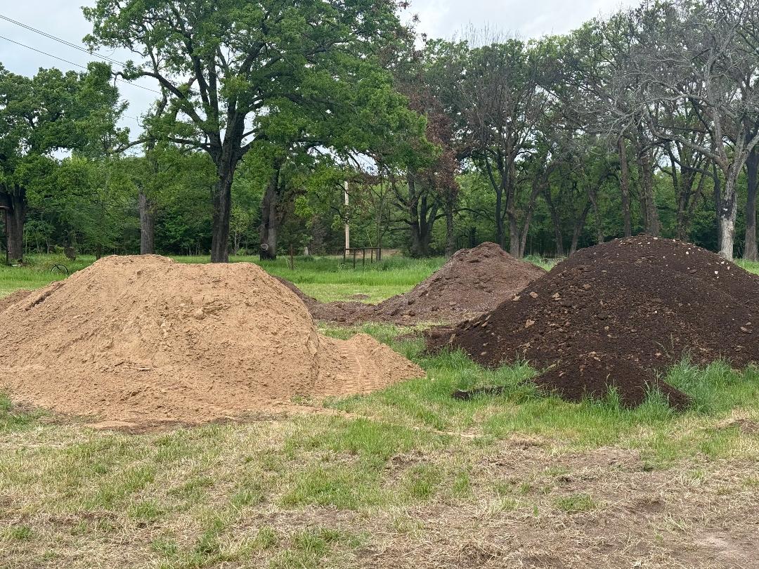 Loader handling bulk topsoil at JKB Materials