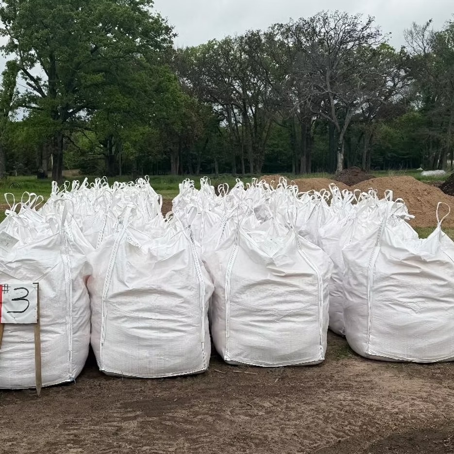 White bulk totes staged outdoors at JKB Materials
